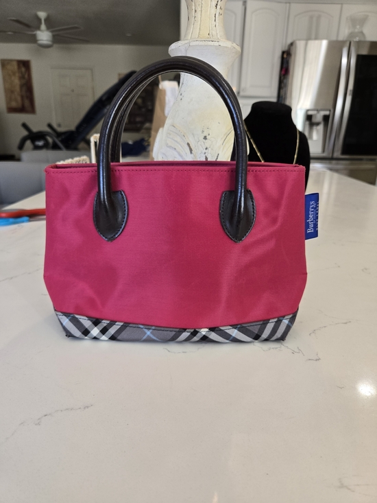 Burberry Handbags - Burberry Red Mini Handbag with Black Handles and Check Trim.  10 X 10.